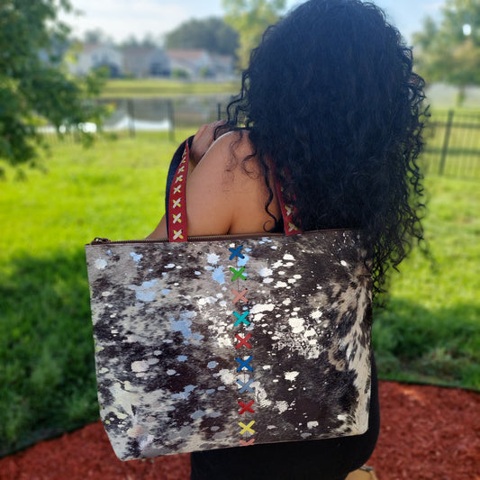 Tote grey and black cowhide with metallic silver paint detail. Leather and hair on hide | travel tote | crisscross brightly dyed leather perfect for Summer | full top zipper closure | Handmade