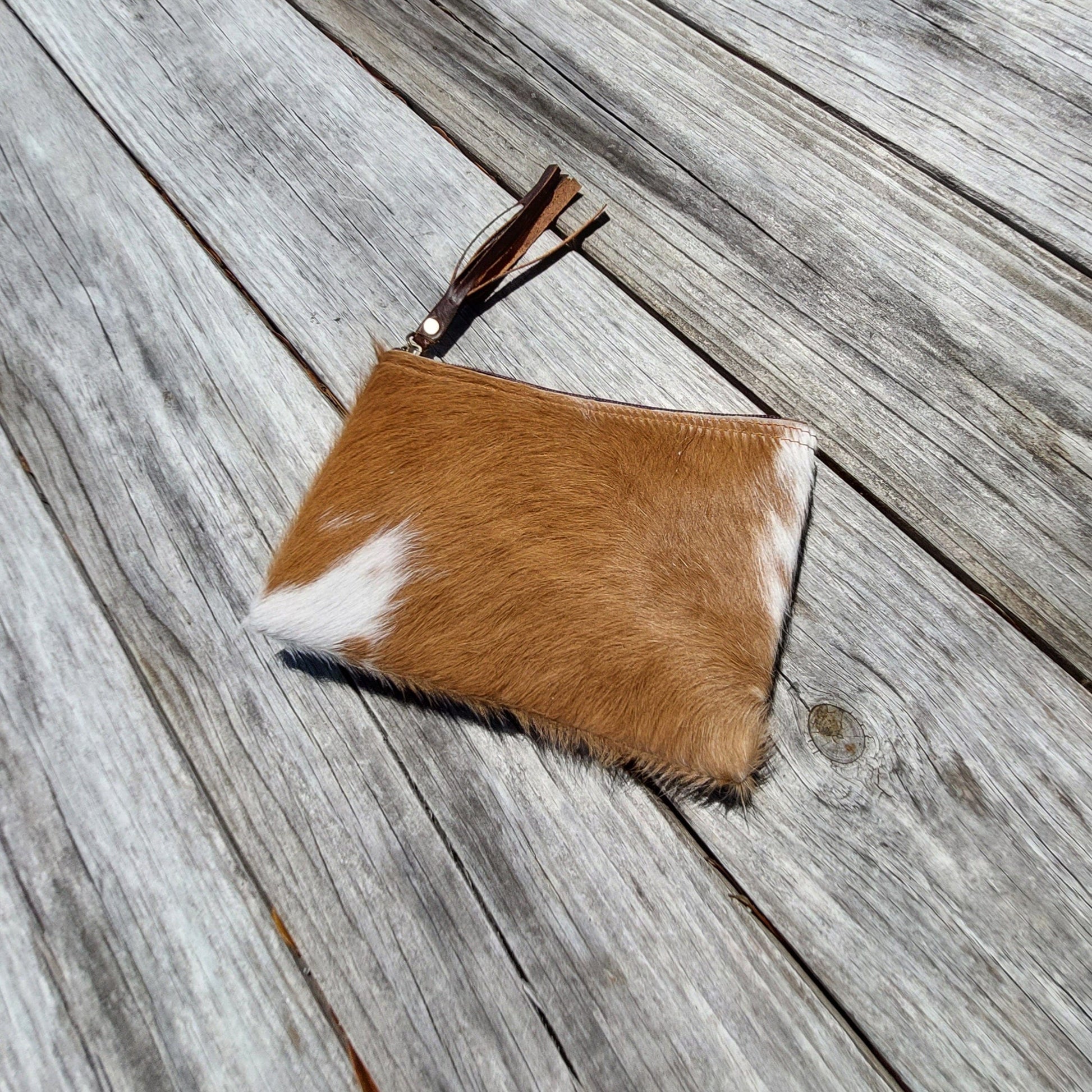 Genuine leather and cow hide pouch